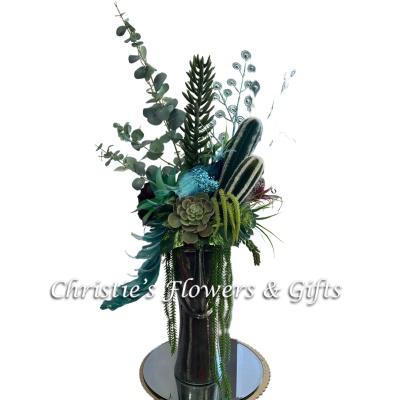 Exotic Succulents in Tall Vase with A Portrail Face and Gorgeous Peacock Pirch